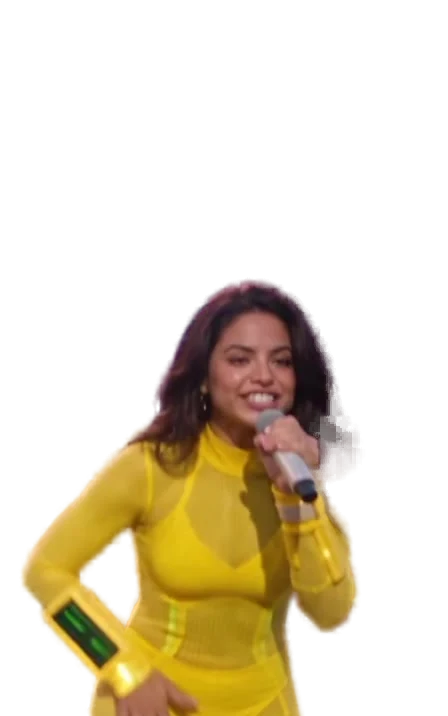 Luah, full body in yellow, microphone in hand, the wristband on her left wrist.