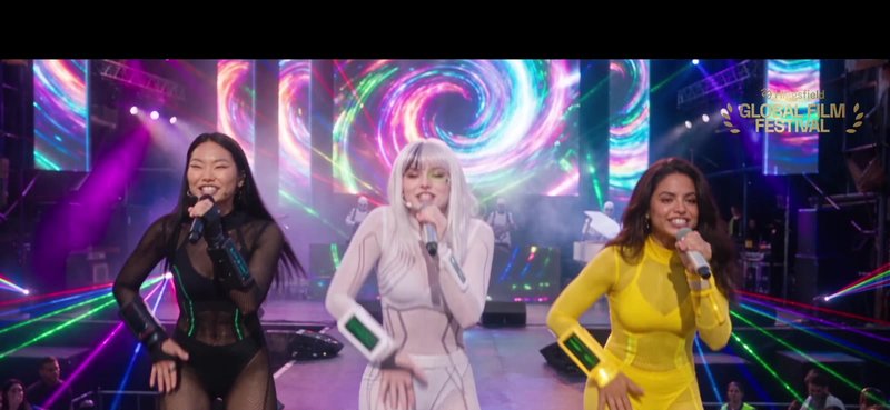Vetkis, white hair and a glowing green monocle, singing on stage.